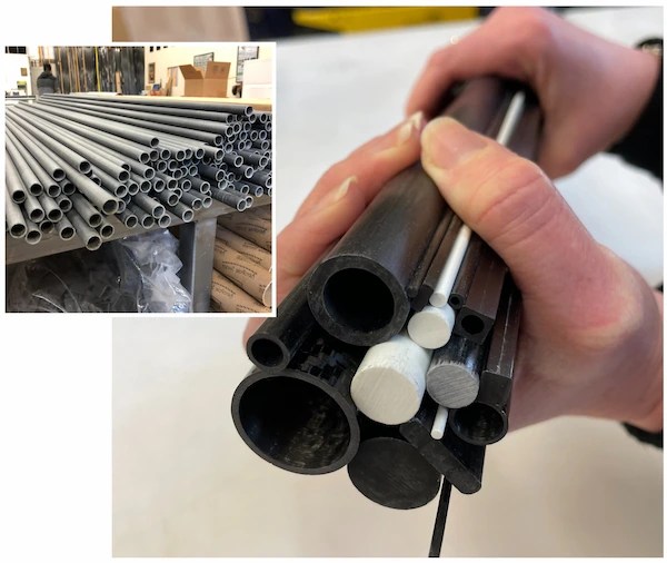 Assorted carbon fiber and fiberglass rods, tubes, and profiles in multiple diameters.