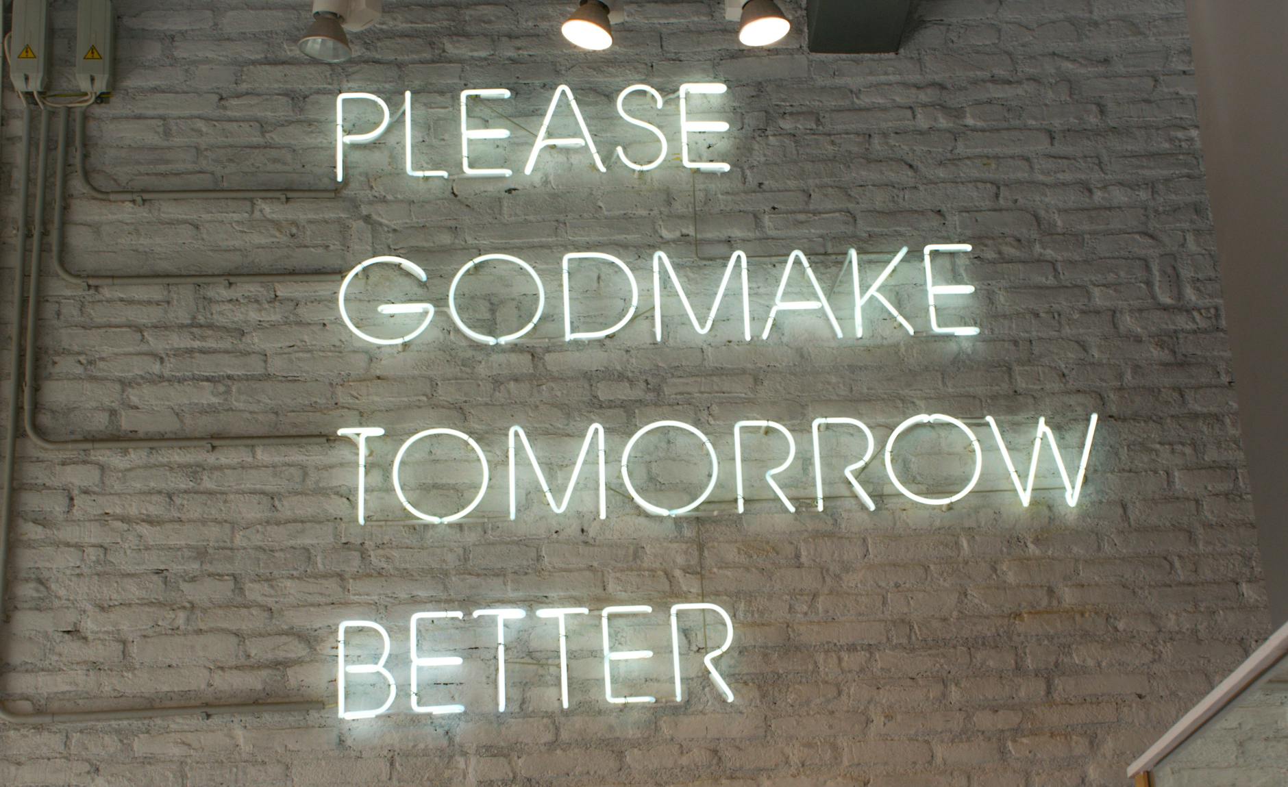 illuminated signage on brick wall
