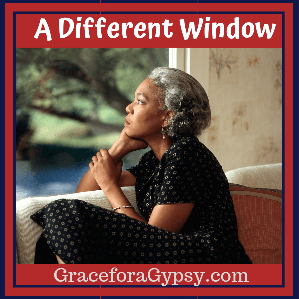 woman looking out a window