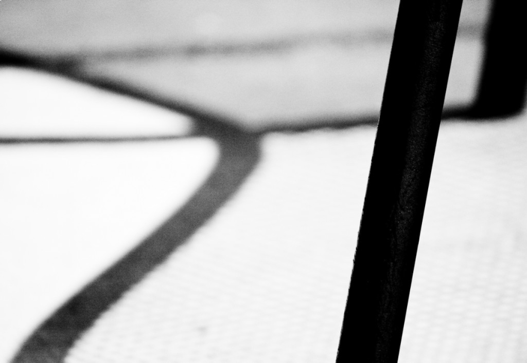 Lines and shadows from a metallic deck chair
