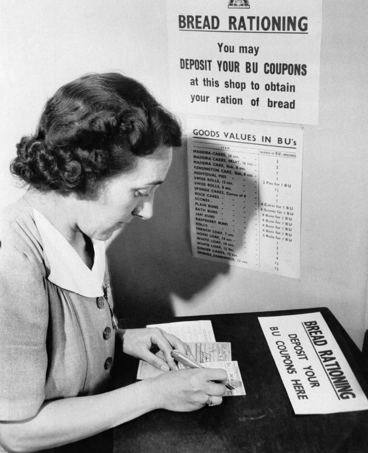 woman filling her bread coupon in 1946