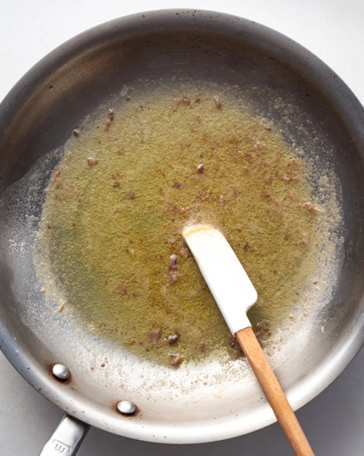 anchovy butter being cooked in a saute pan