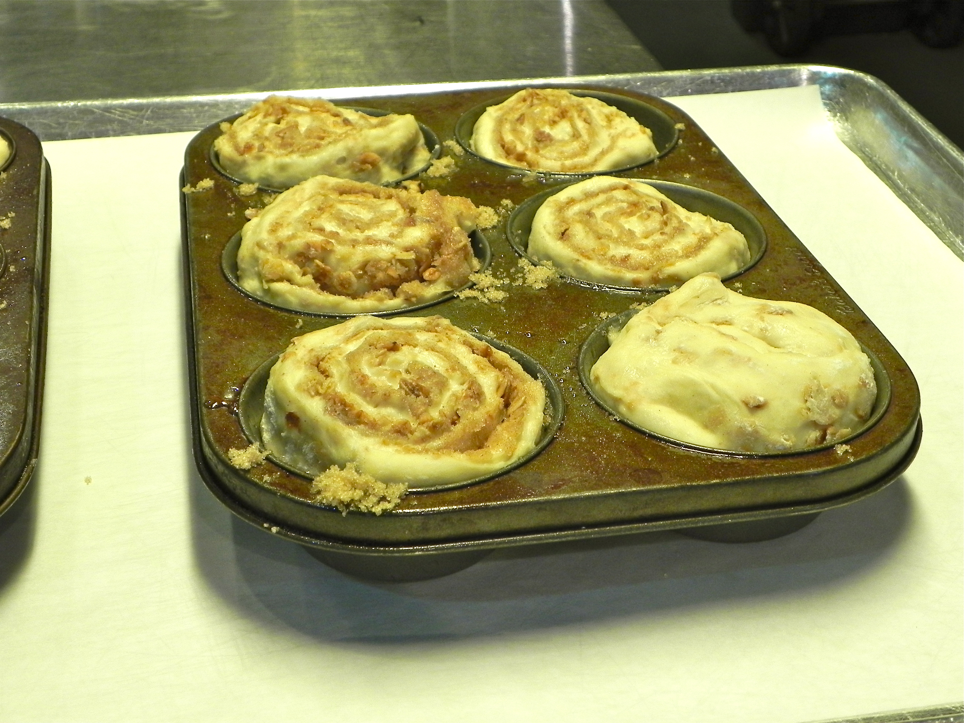 Once you've added the buns to the pan, place in warm area in kitchen and allow them to rise for an hour.