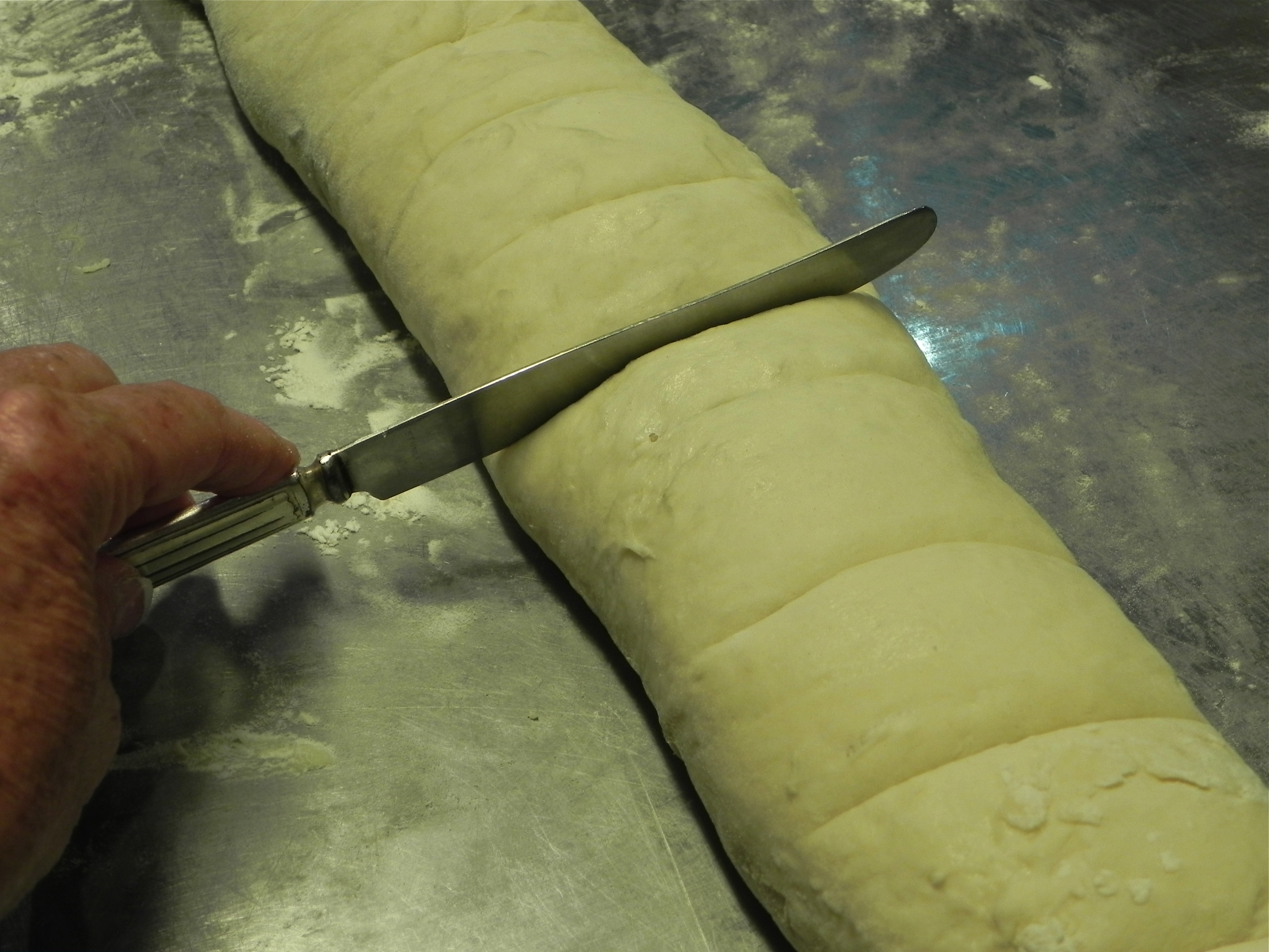 Use a knife to make cut marks for equally-portioned buns