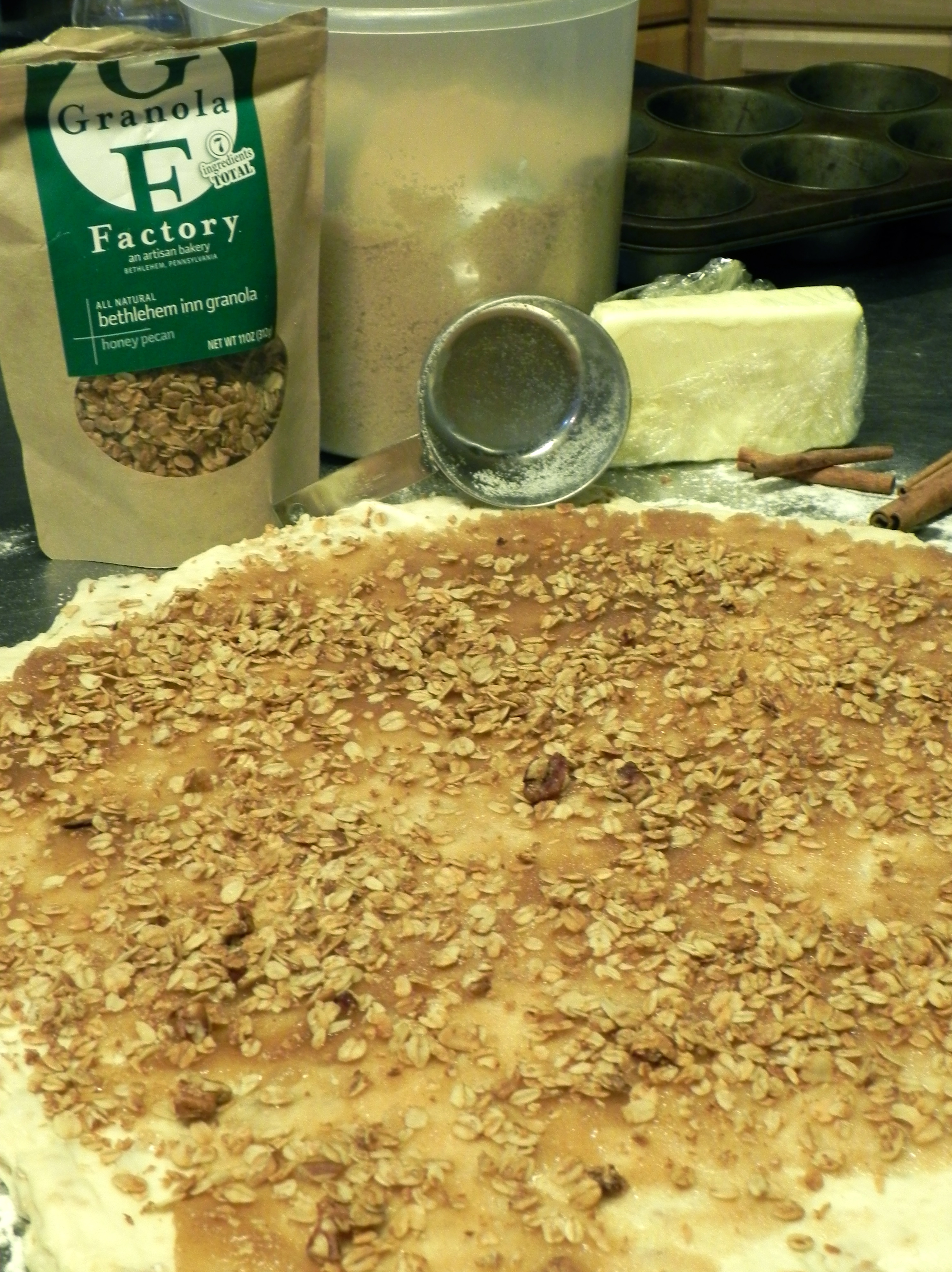 Once the cinnamon sugar is spread on dough, sprinkle with granola.