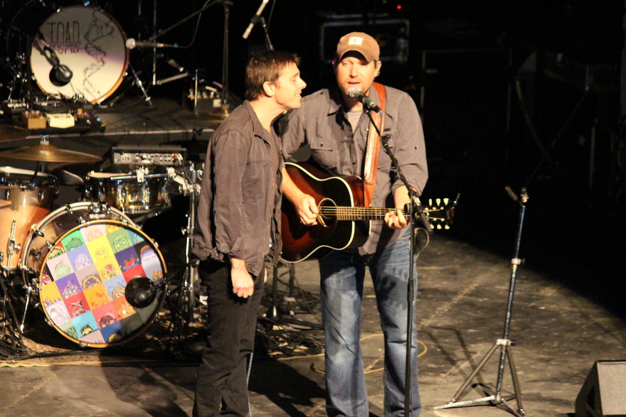 Two musicians talking on stage before show
