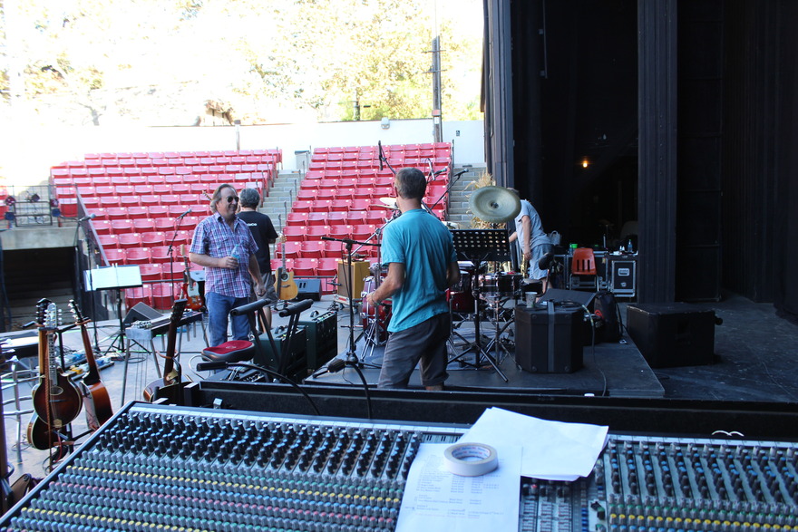 Crew setting up gear at outdoor bowl