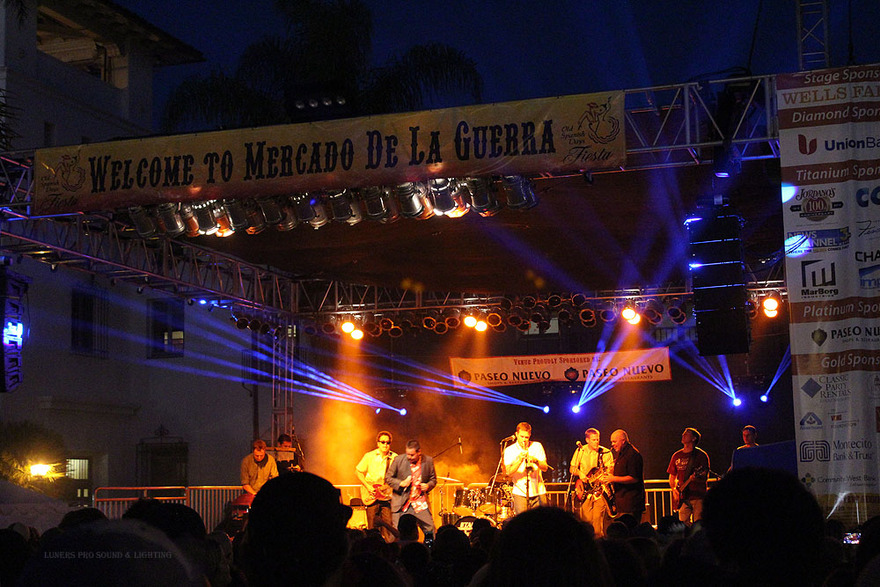 Festival stage at night under blue beams