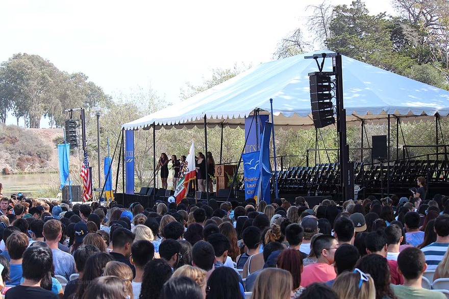 Crowd under a tent at commencement