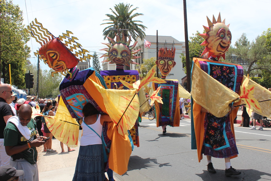 Sun-mask costumes on the parade route