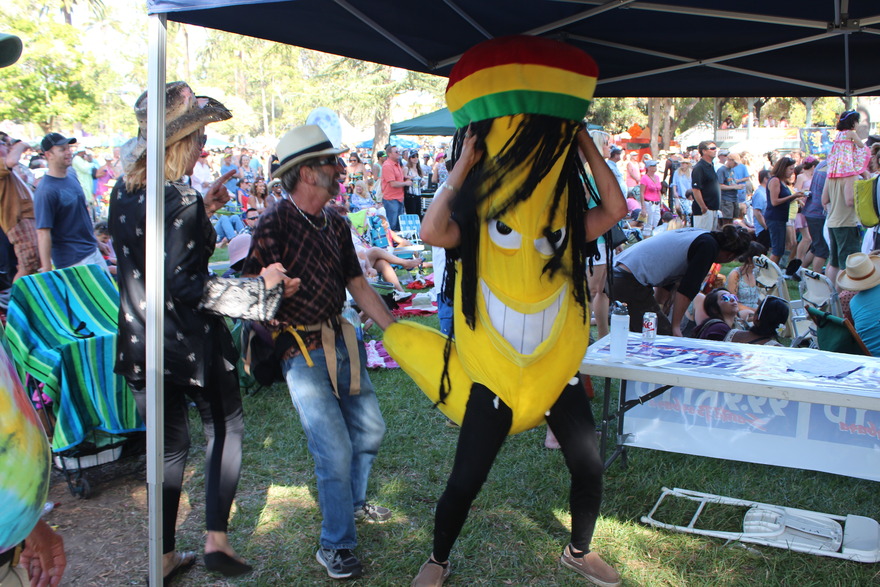 Costumed performer dancing among the crowd