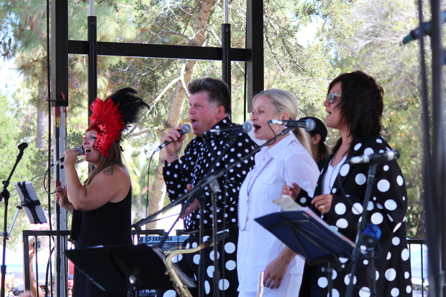 Vocal group performing in polka-dot outfits