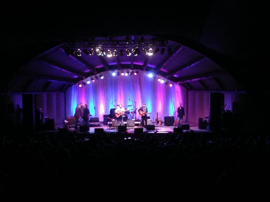 Band on bowl stage under purple wash