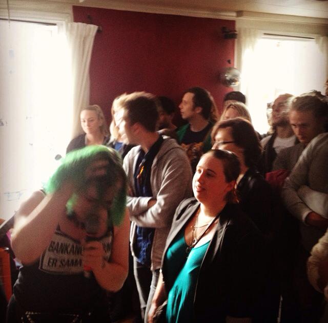 Börn's Alexandra, rocking out and wearing a sweet t-shirt that reads: "Your bank doesn't give a shit about you."