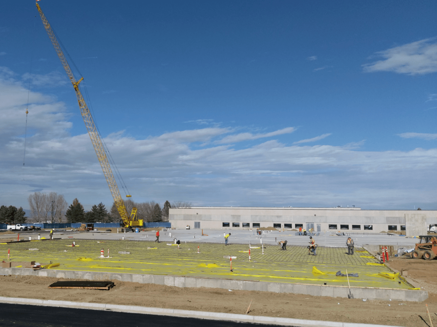 Reinforced concrete slab preparation with rebar and vapor barrier at Hach R&D Expansion project in Loveland, Colorado