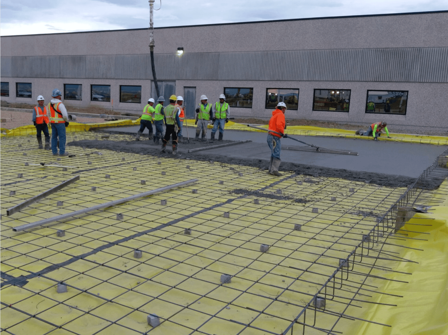 Concrete slab placement and finishing over reinforced subgrade at Hach R&D Expansion in Loveland, CO