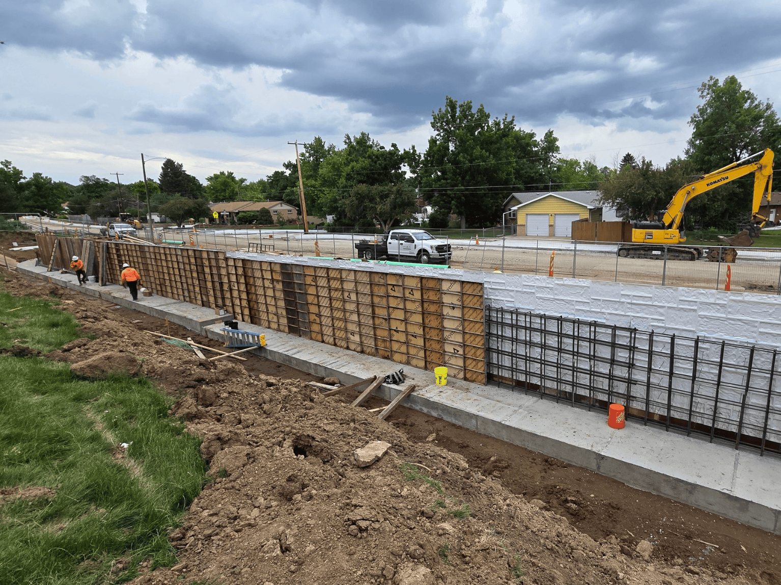 Cast-in-place concrete retaining wall formwork and reinforcement at school parking lot project in Littleton Colorado