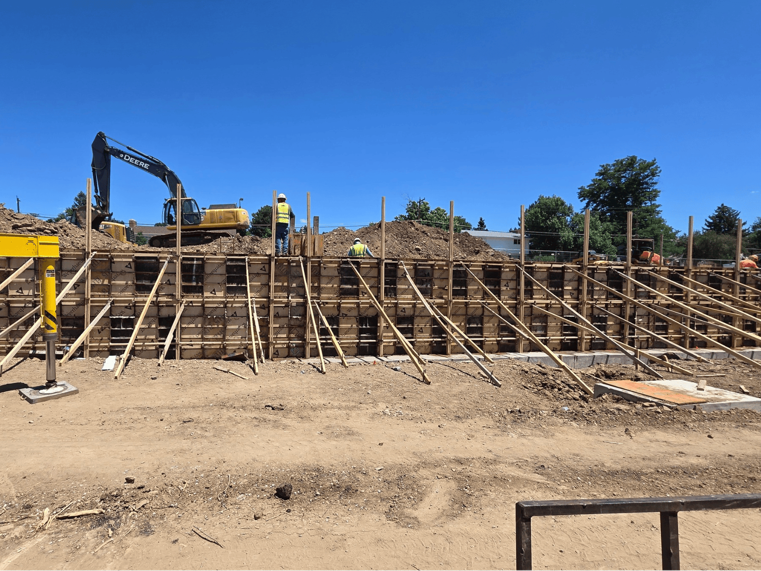 Concrete wall formwork bracing and excavation during site development project in Littleton CO
