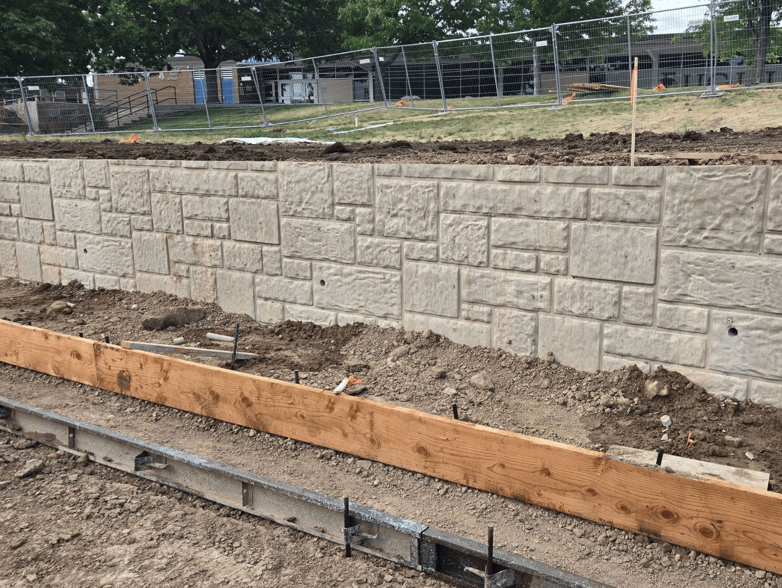 Close-up of decorative cast-in-place concrete retaining wall texture and finish in Littleton CO