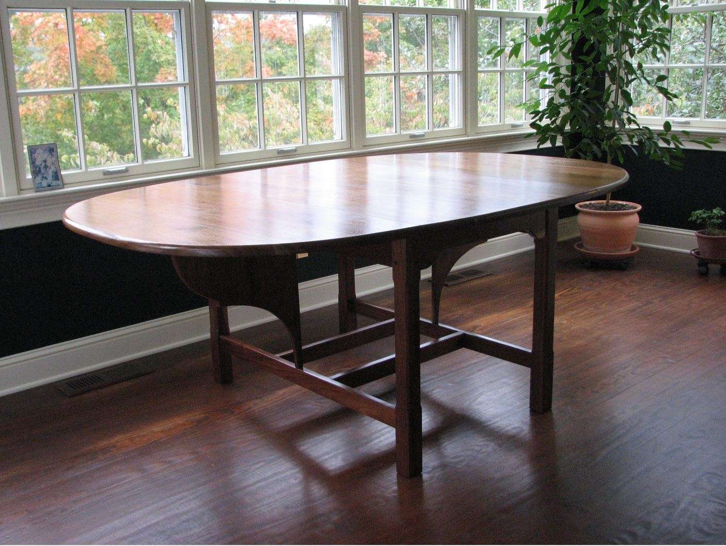 walnut drop leaf oval table