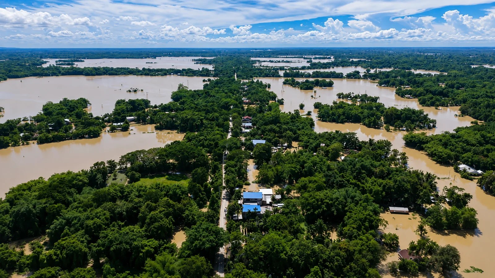 Aerial view showing the widespread impact of Assam floods across villages and farmland