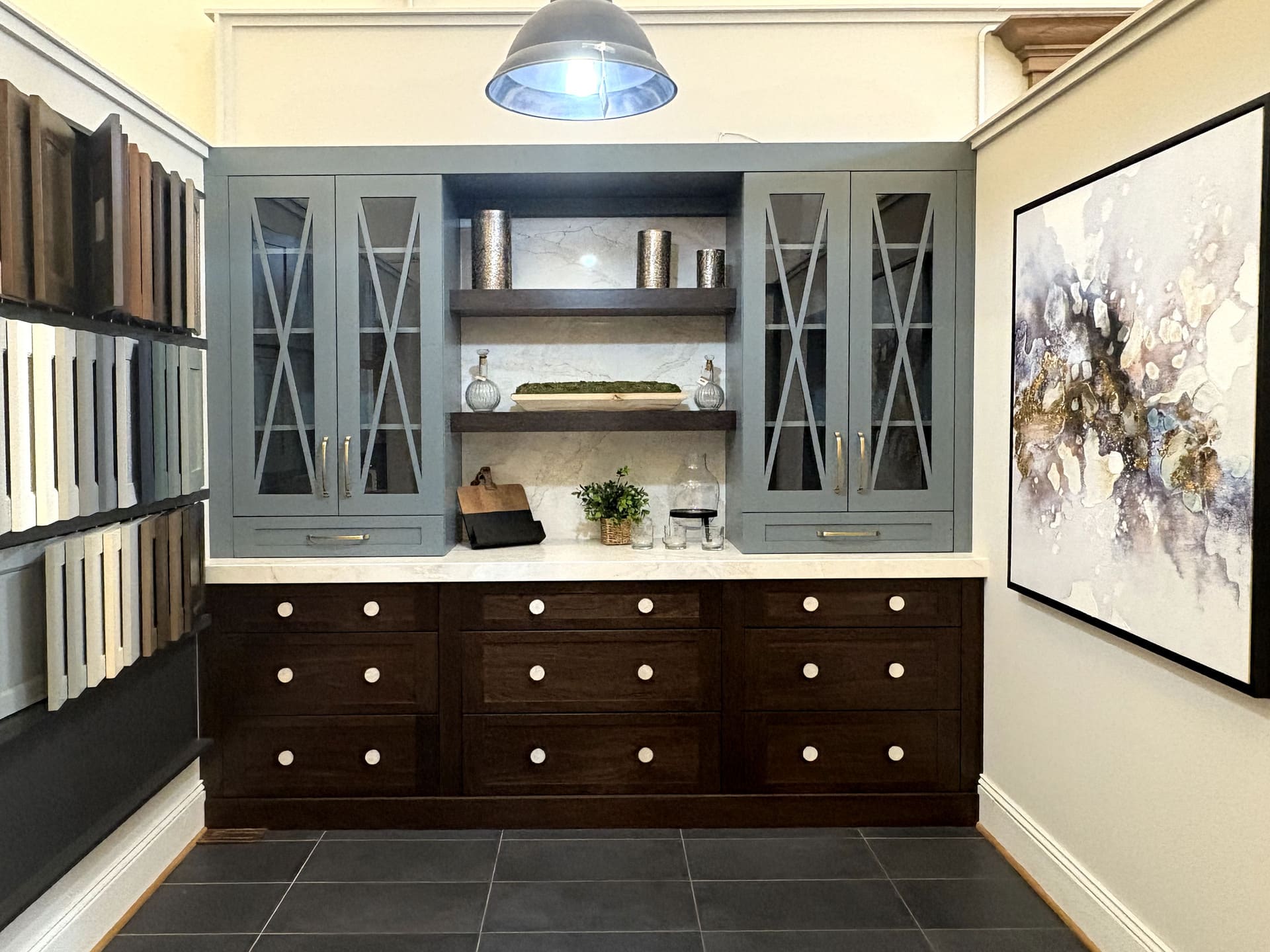 a room with a grey cabinet and shelves