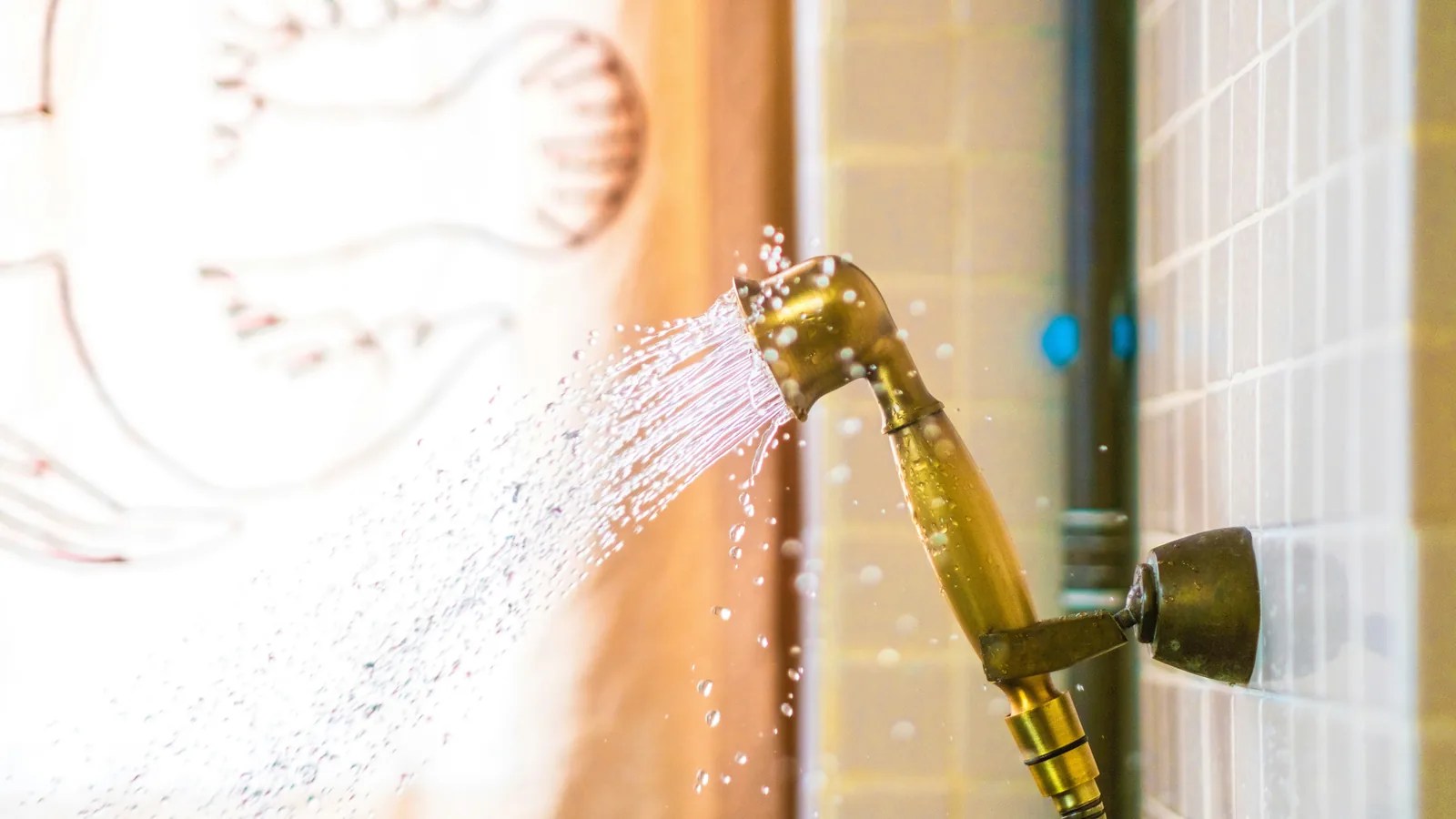 Low-flow showerhead running in a residential bathroom