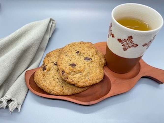 Chocolate chip cookies with a cup of green tea