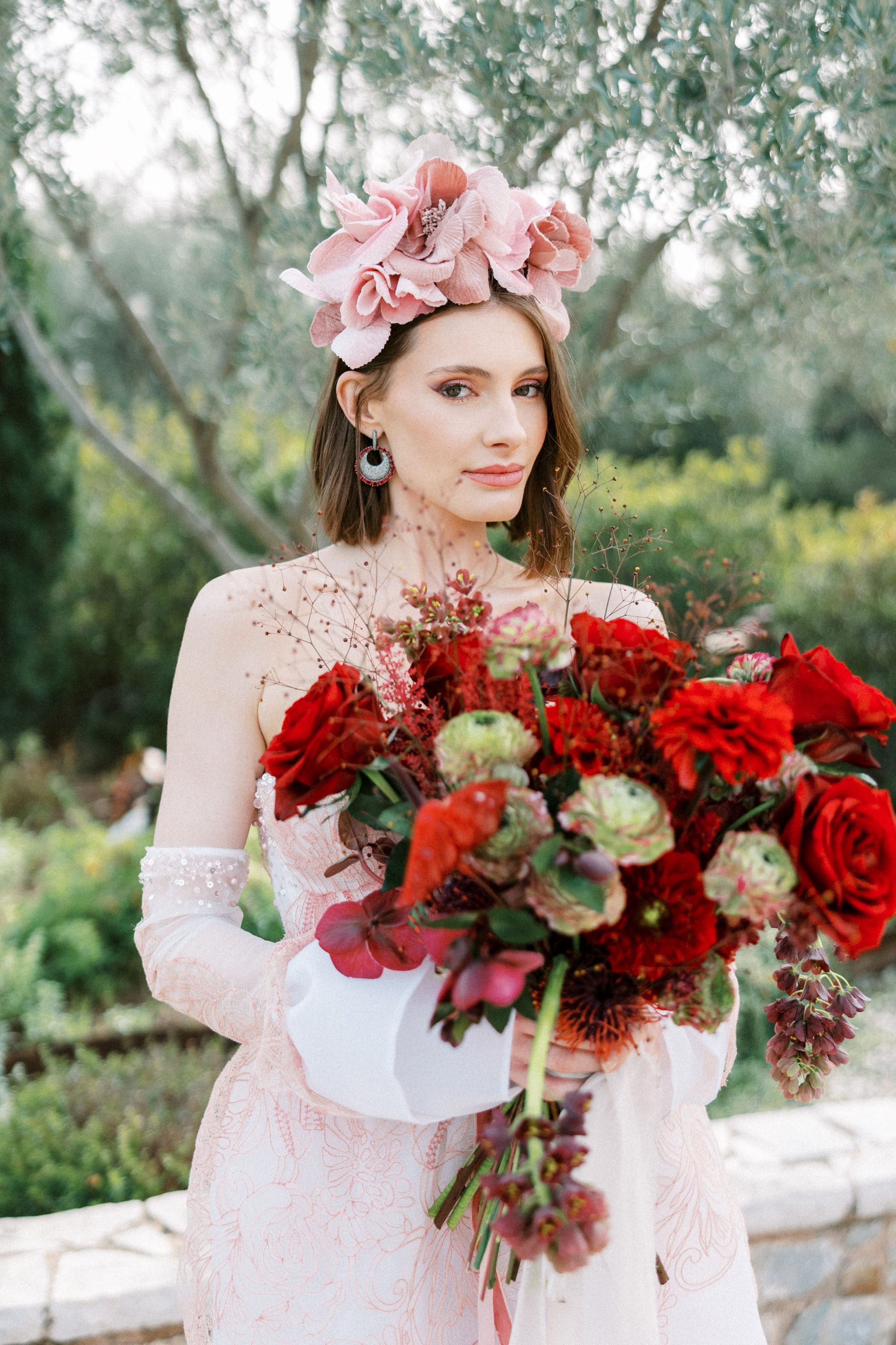 bride with red bouquet