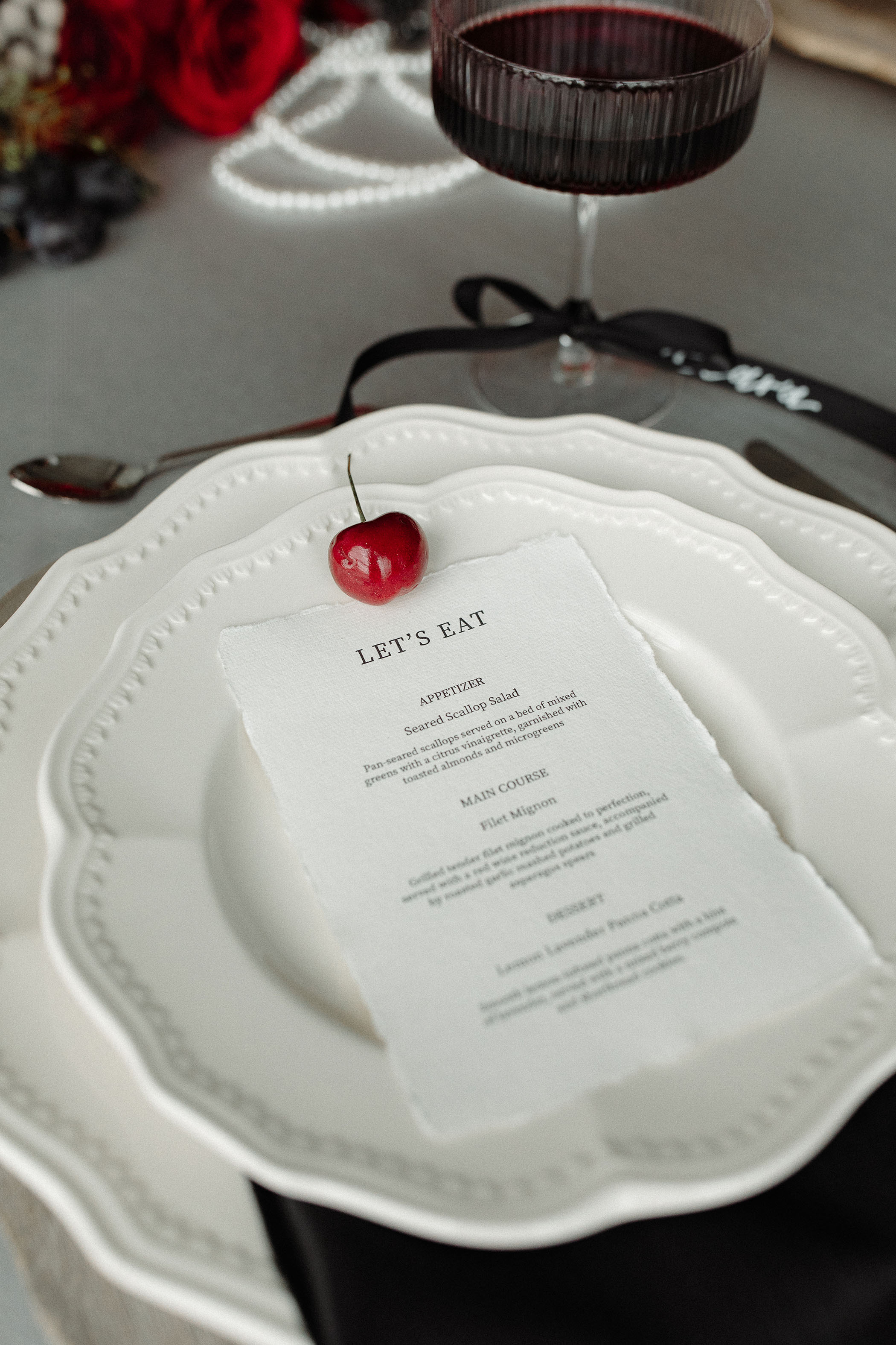 menu with a cherry on top of it for a Taylor Swift TTPD wedding photoshoot