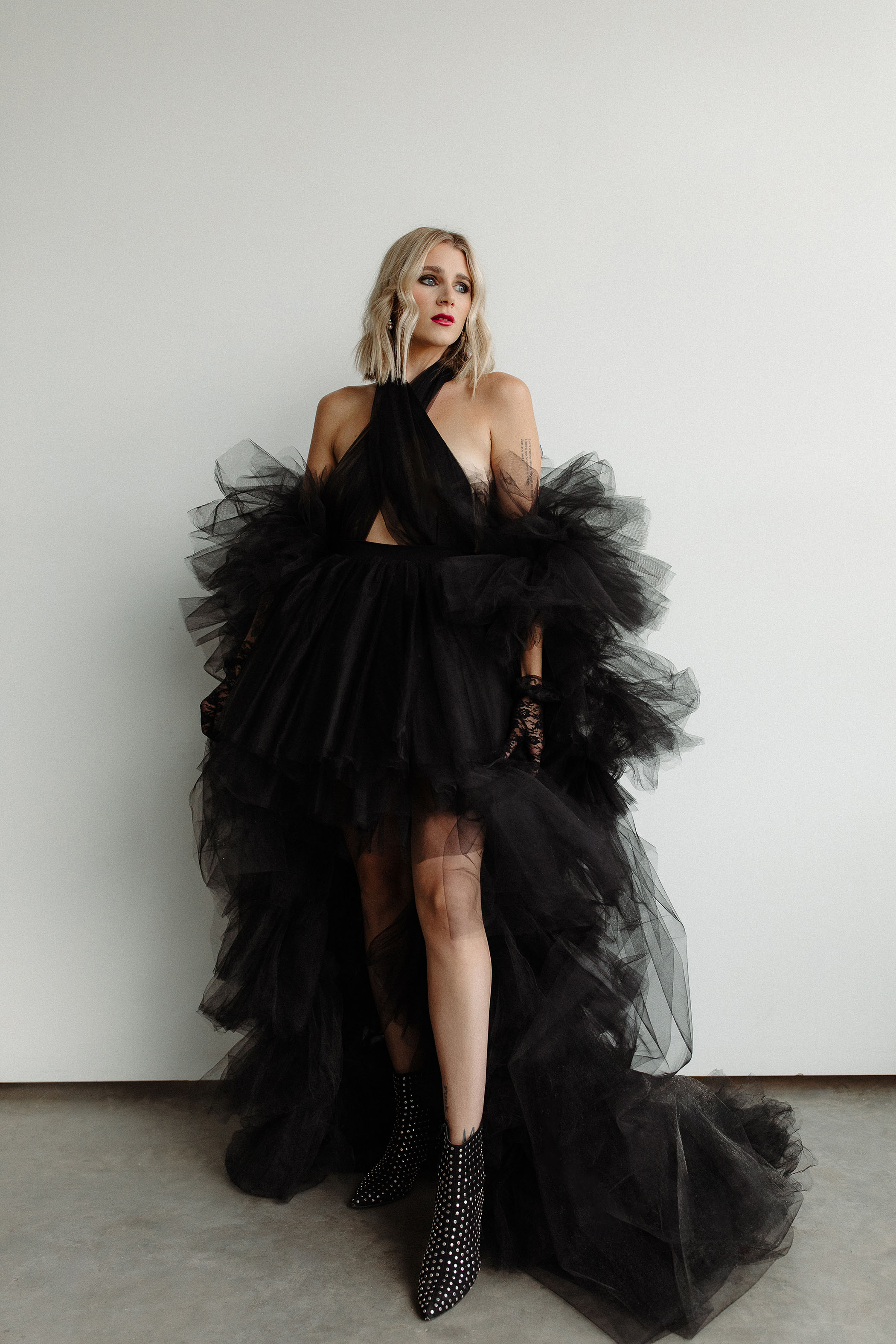 woman in a halter style black tulle layered gown for a TTPD photoshoot