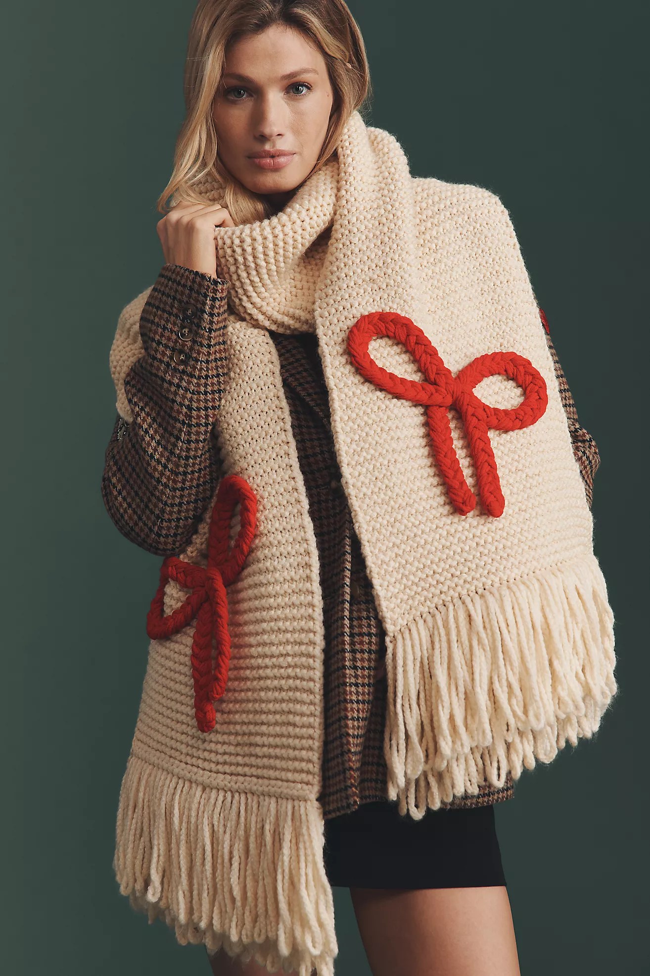 girl with a chunky knit red bow scarf