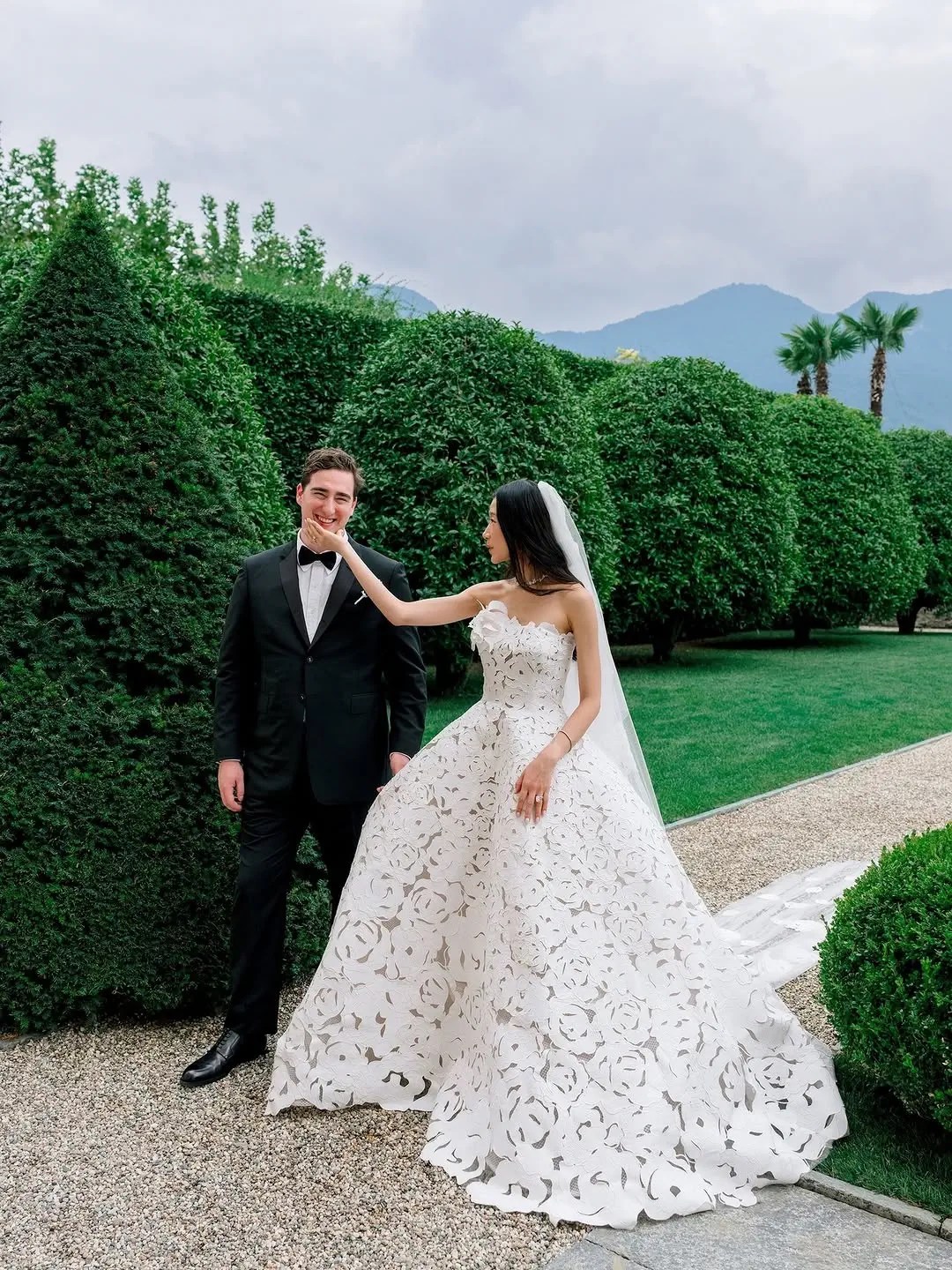 Becca Bloom in her Oscar de la Renta lace wedding dress