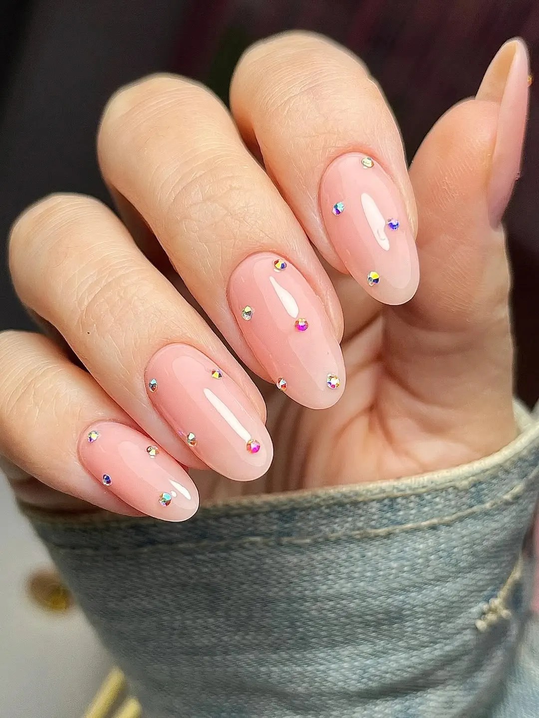 simple almond shaped manicure with 3D rhinestone designs