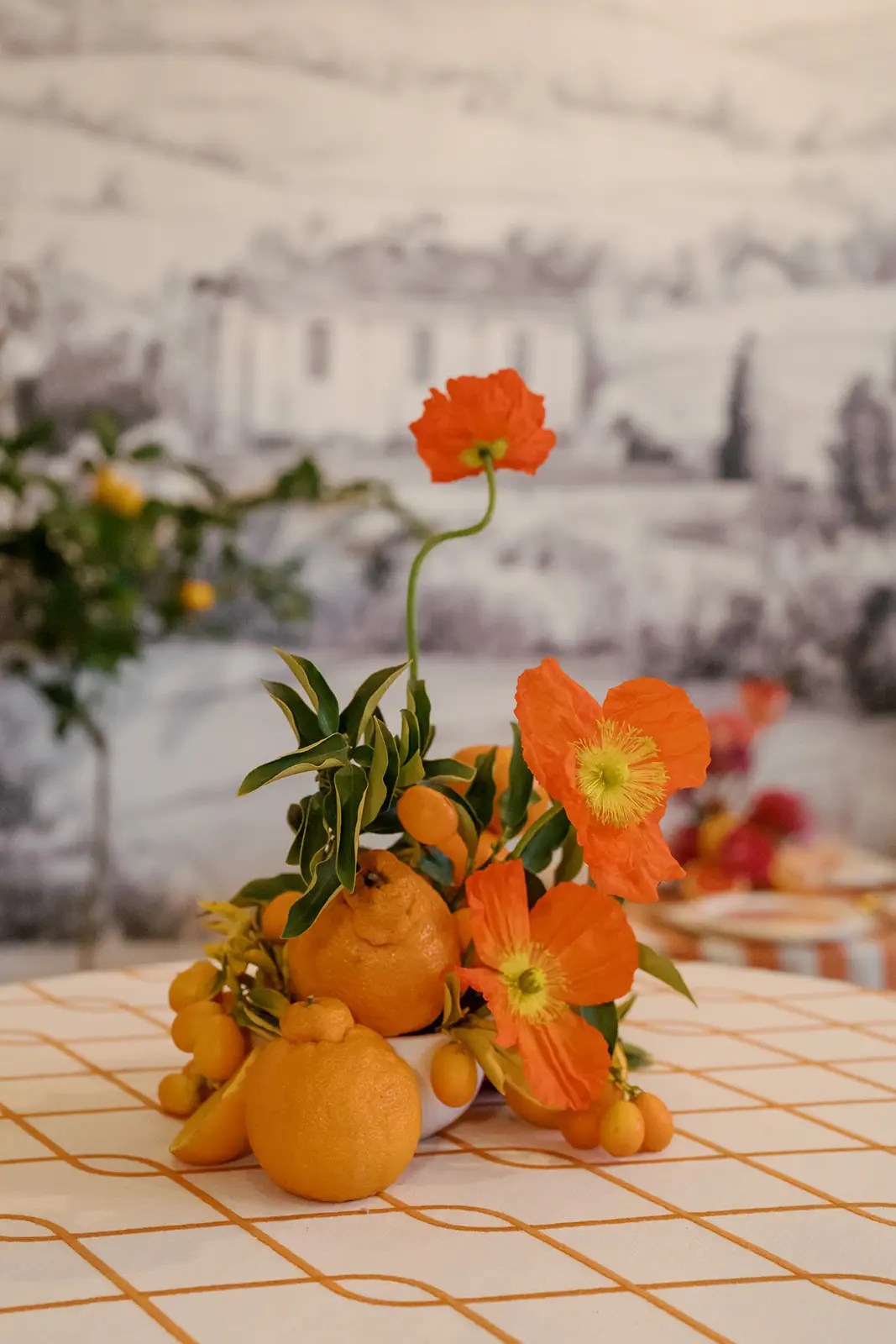 sumo oranges and poppies for centerpiece at wedding