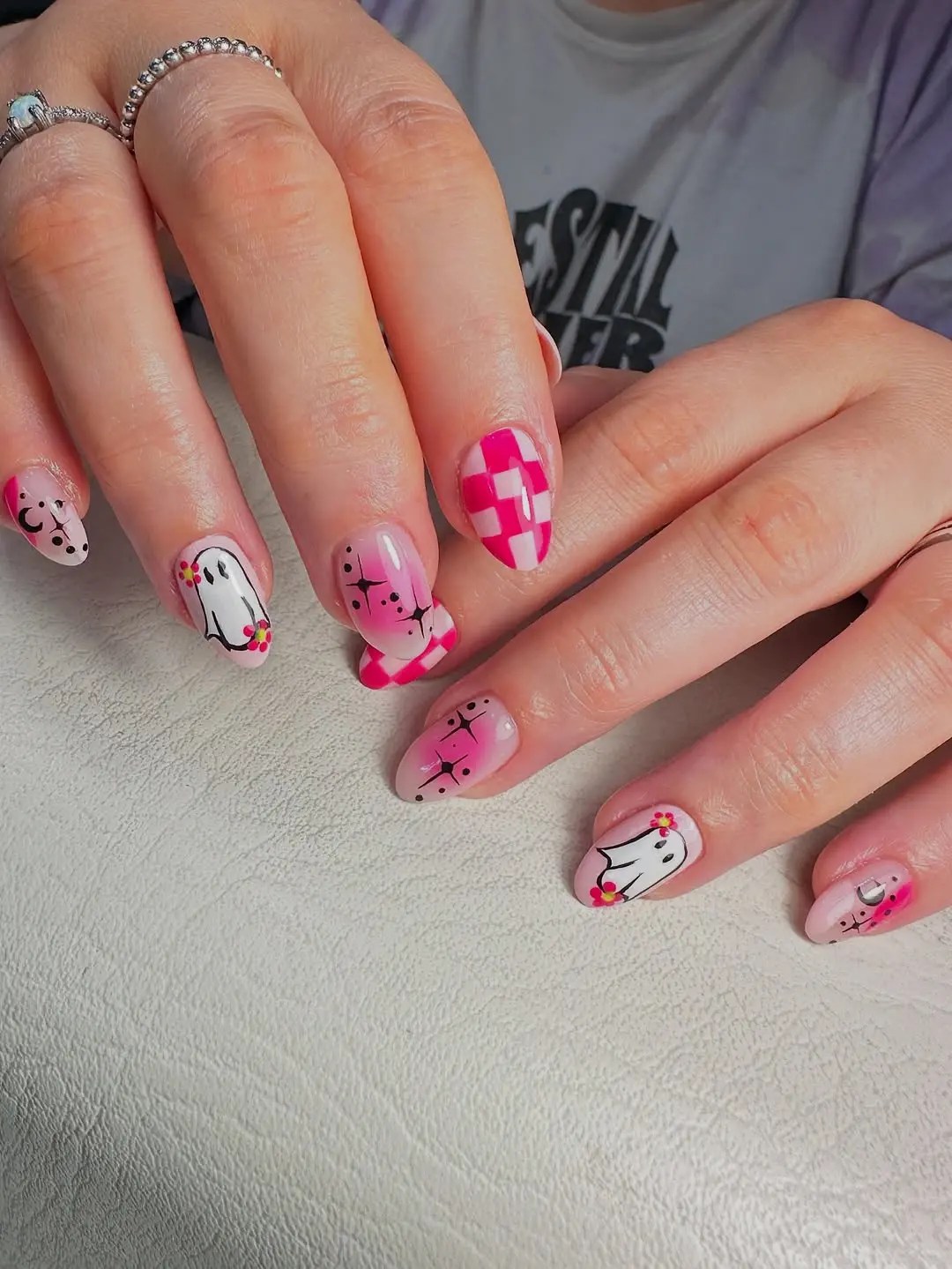 Pink Summerween nails with white ghosts in flower crowns, hot pink checkerboard, and airbrushed sparkle accents