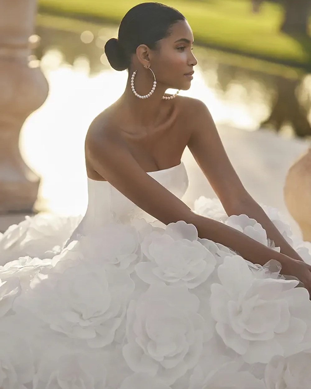 Close view of the hand-built organza flowers on the Rosa Clará ORESTE wedding dress skirt