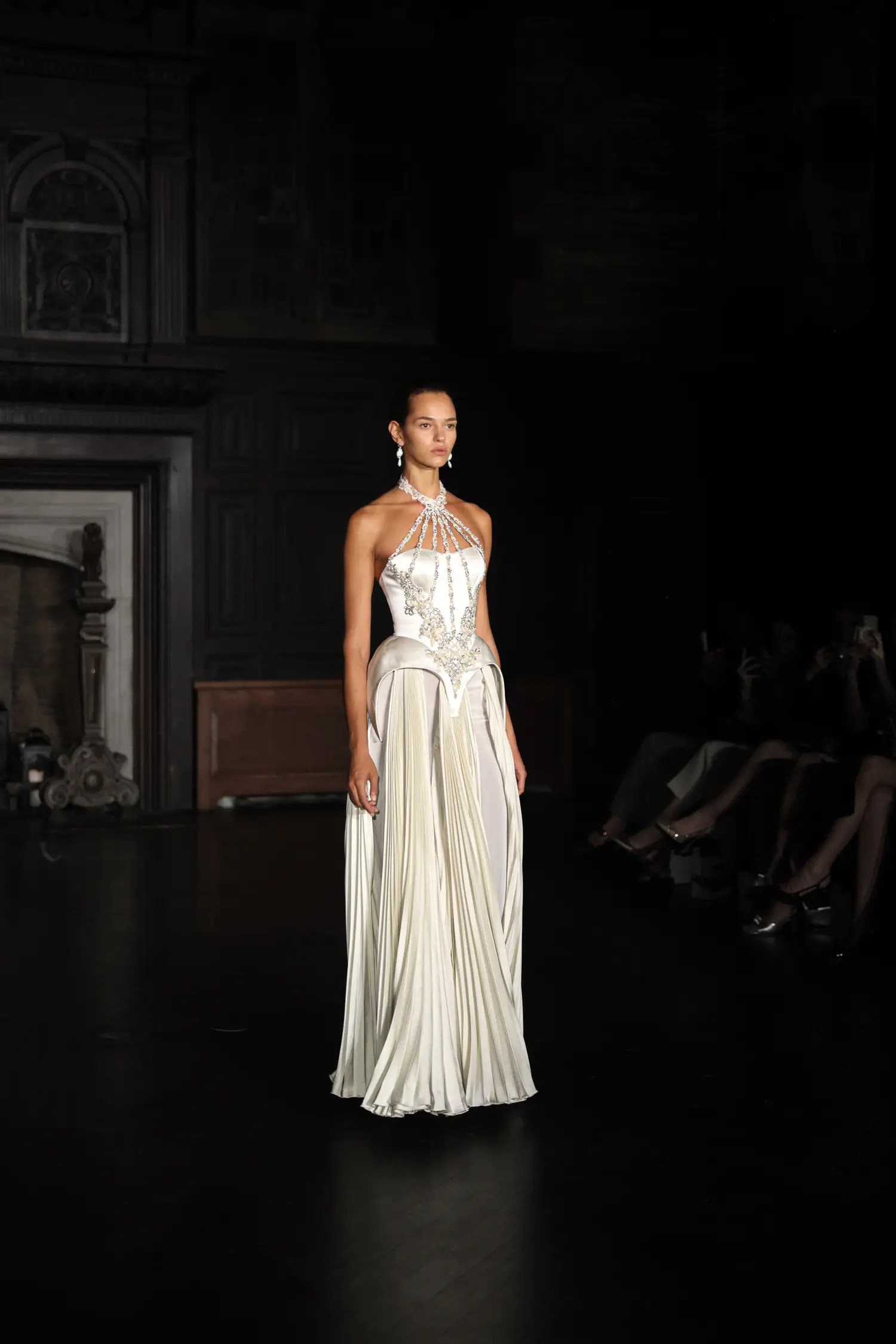 Alon Livné Fall 2027 pleated column gown with sculpted halter bodice