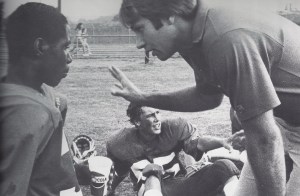 Coach Daniel coaching. The author sitting in the background.