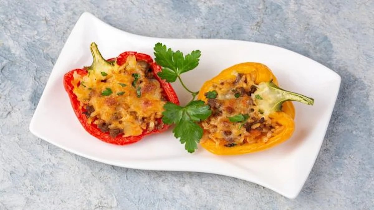stuffed capsicum served in a white plate