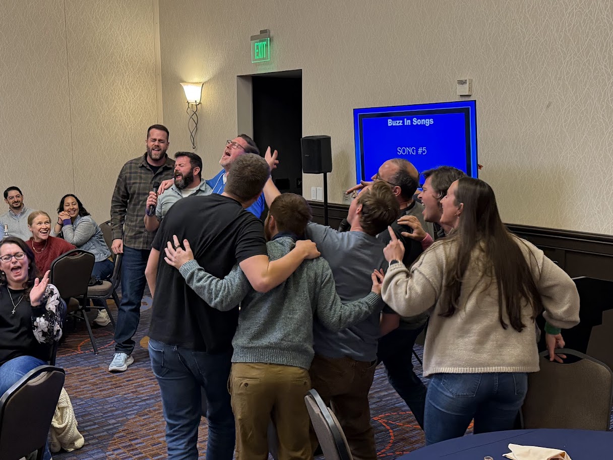 Team having fun singing Karaoke