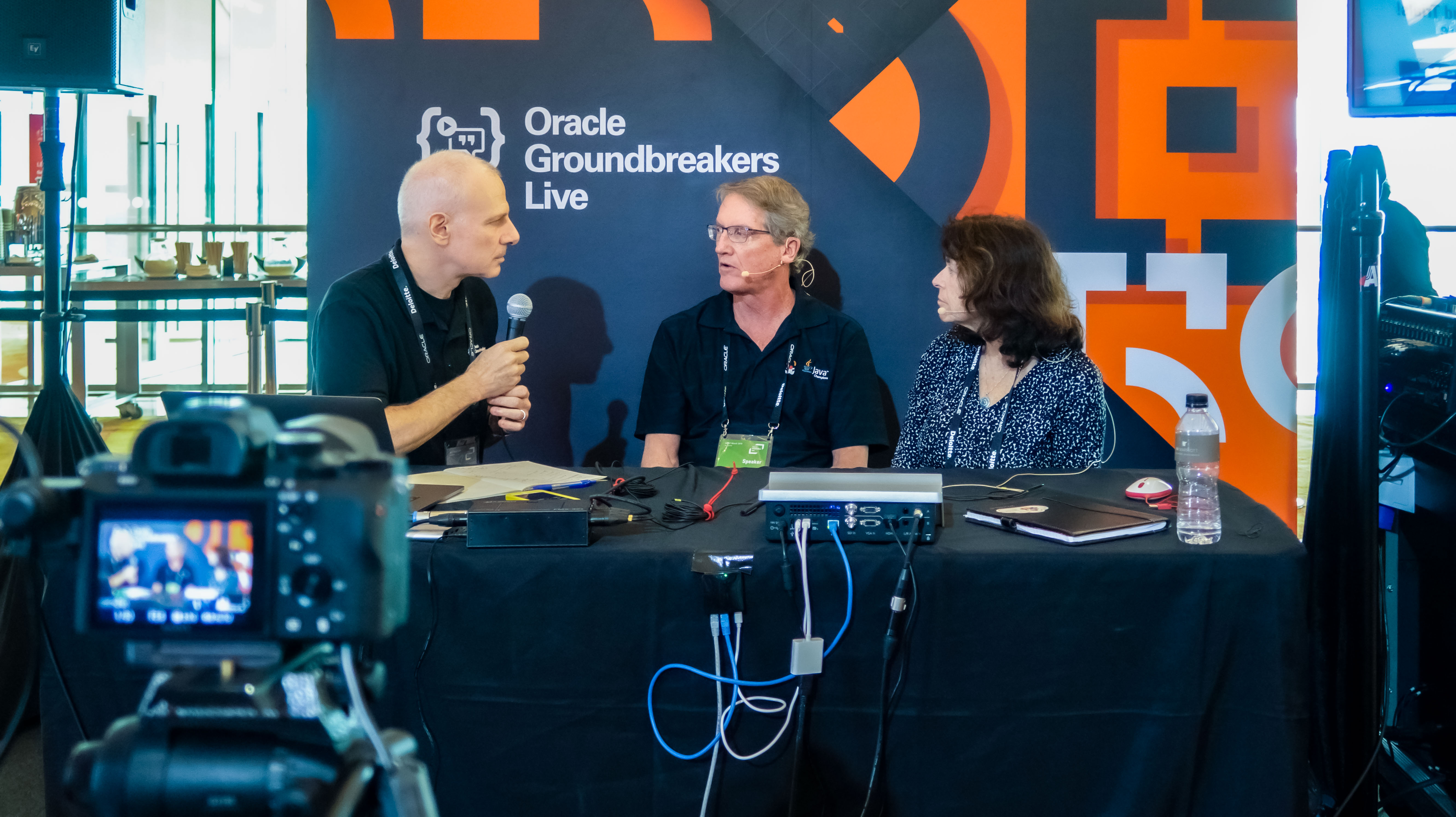 Jim Grisanzio interviewing Paul and Gail Anderson at Oracle Code in Singapore in 2019.