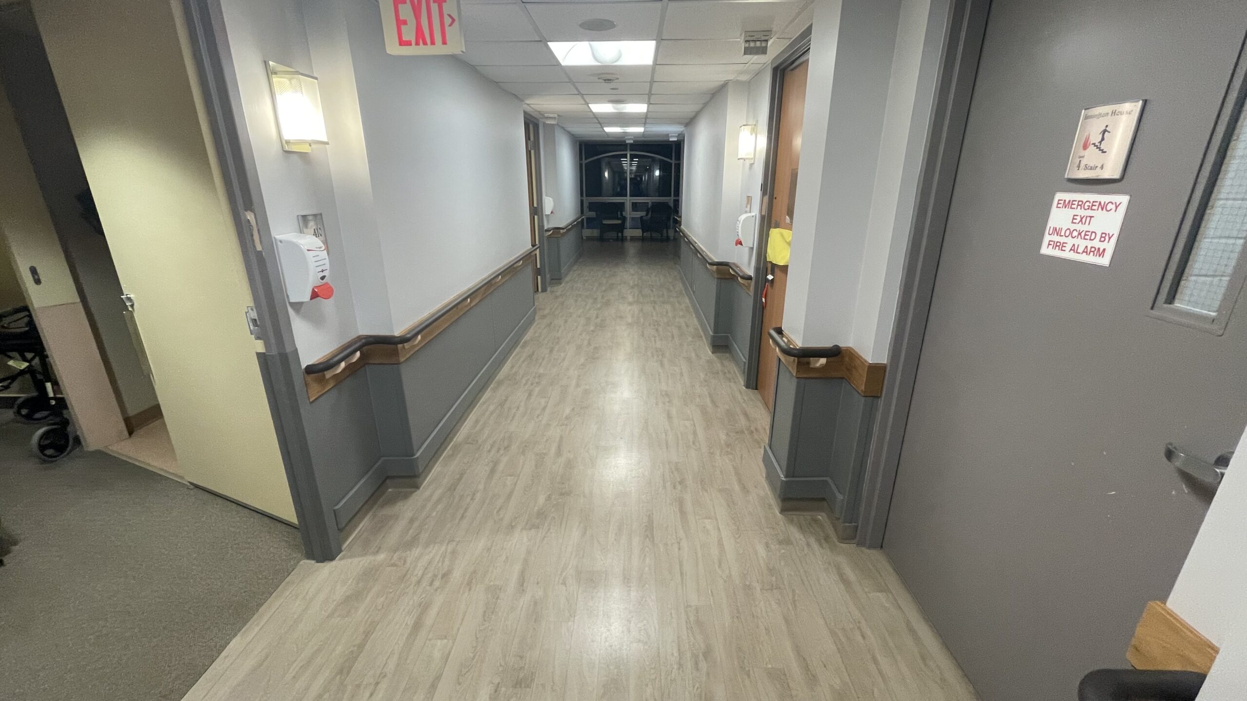 Long-term care corridor with handrails and wall protection installed by GRIT