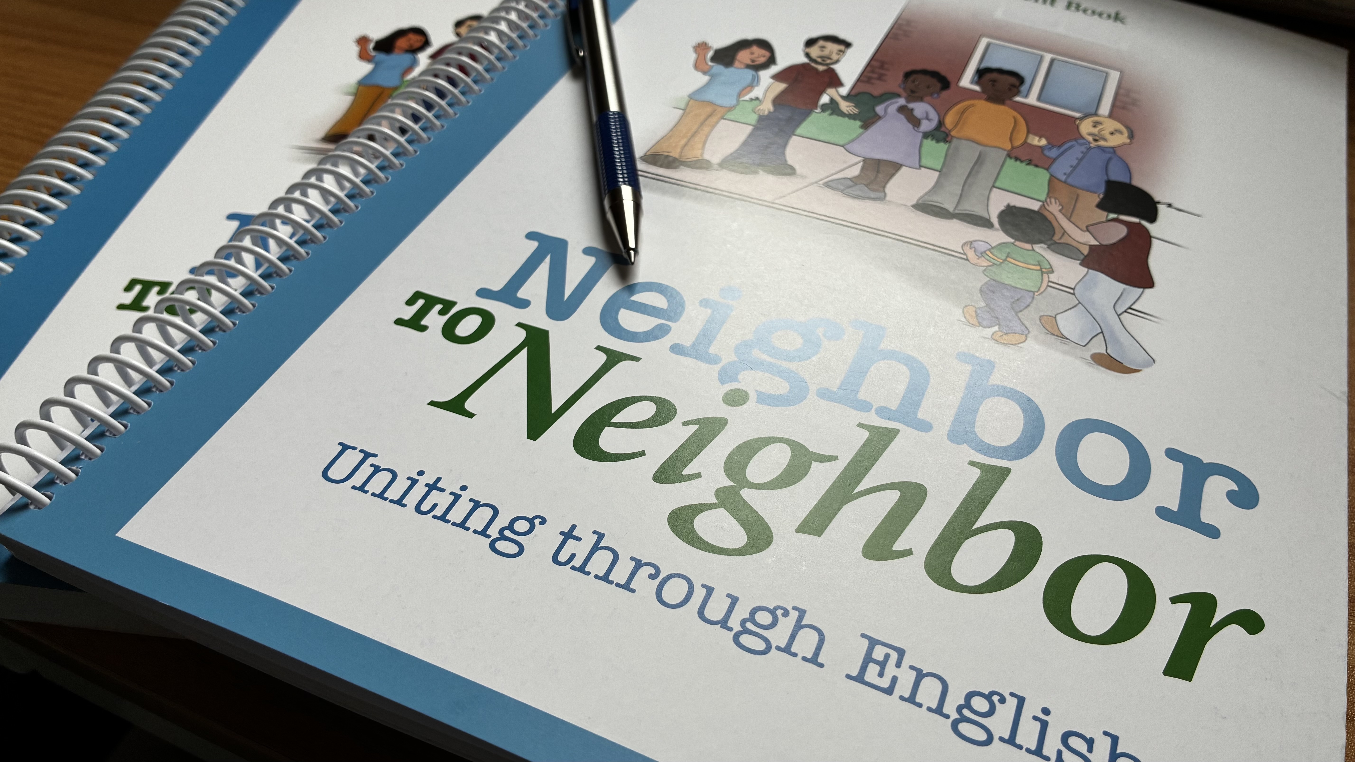 The Neighbor to Neighbor: Uniting Through English textbook used in class