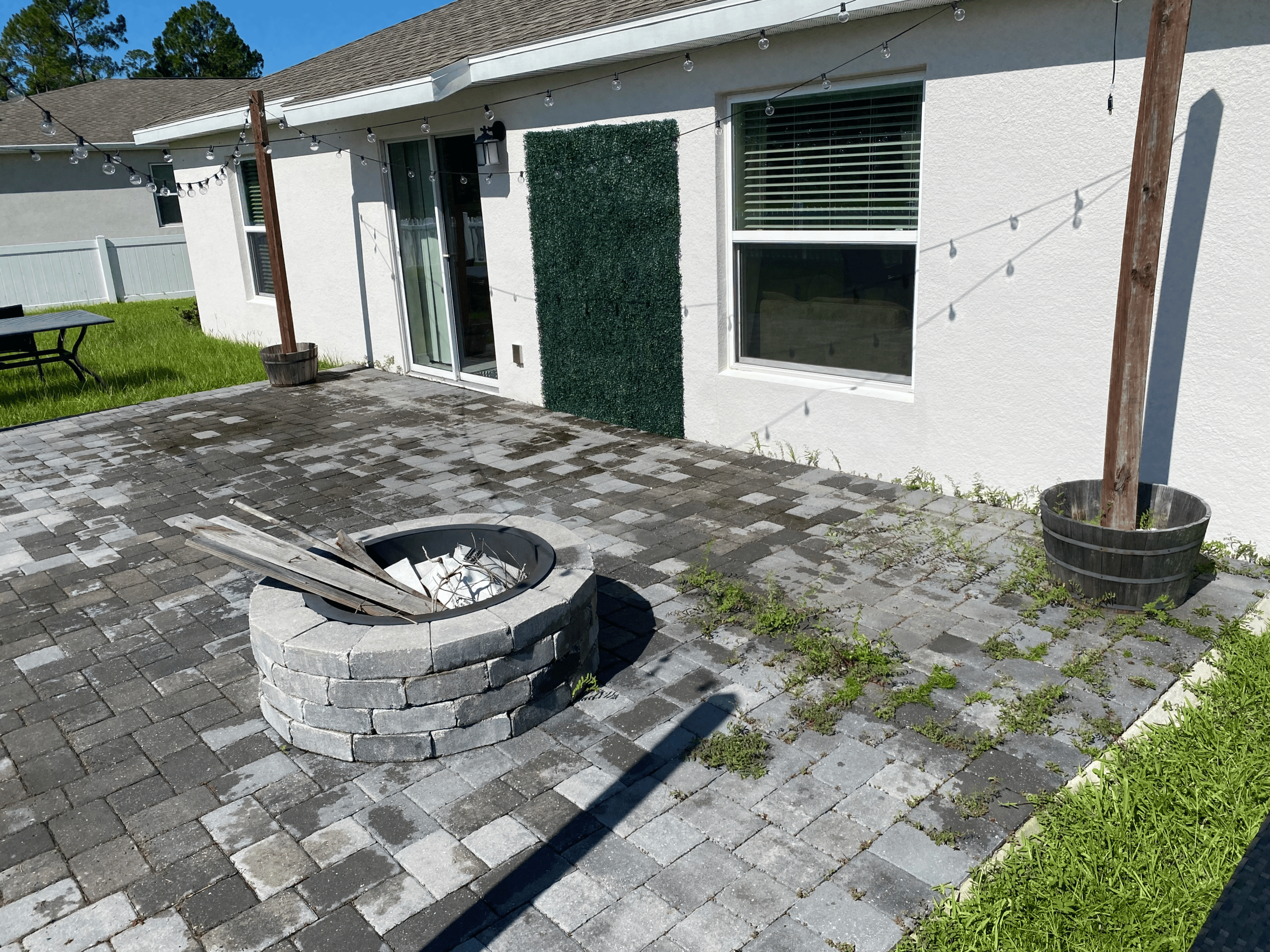 Exterior paver patio with visible surface buildup