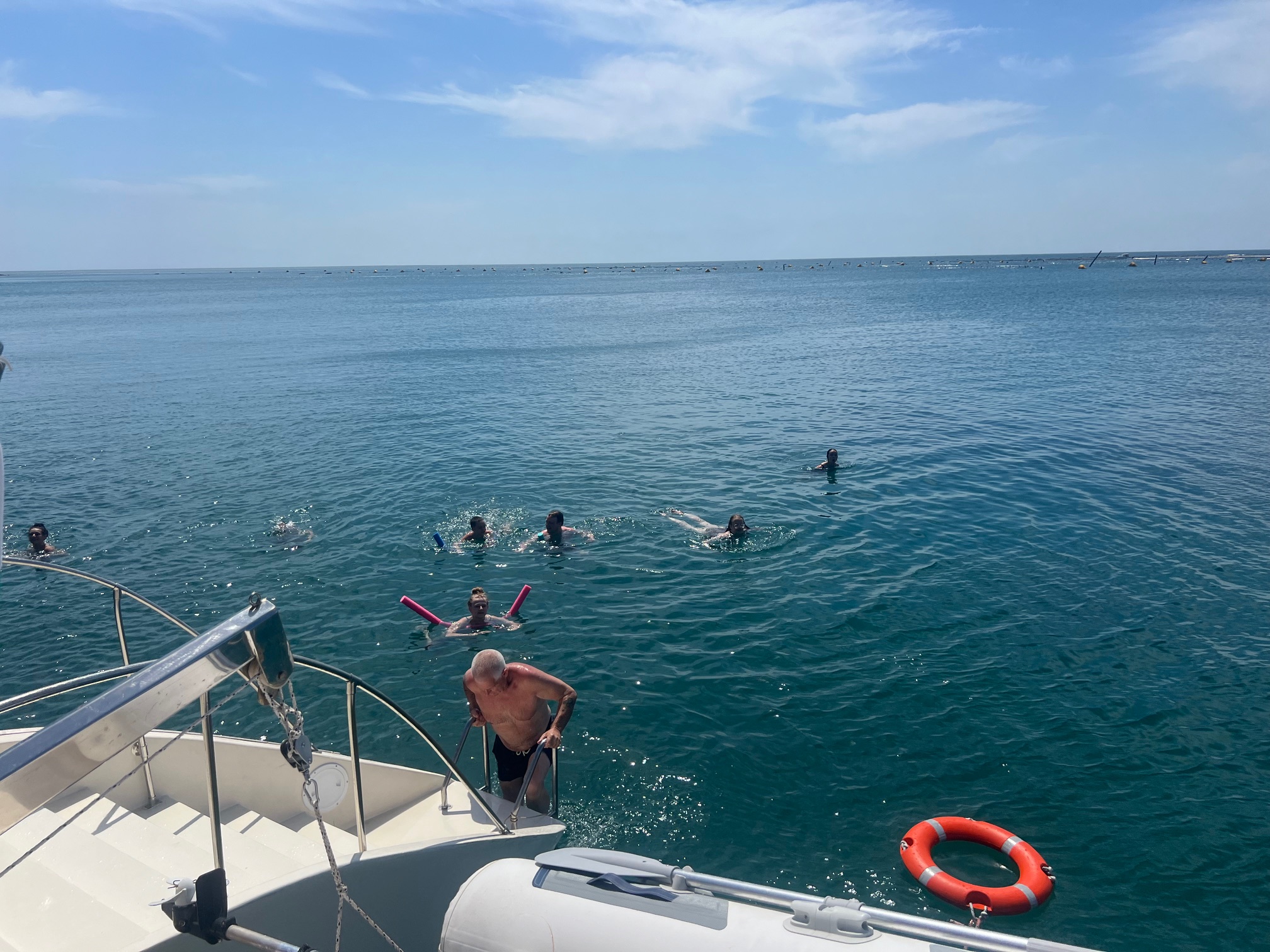 people jumping in the Bay of Sunny Beach during Catamran Cruise Sunny Beach
