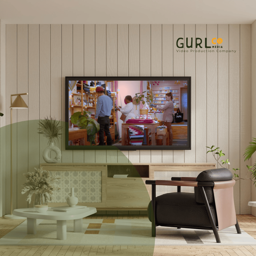 Smart TV mounted in a modern living room displaying a local business commercial, featuring GurlCo Media blog graphics on CTV advertising.