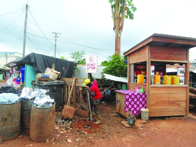 A sign being erect in Port Kaituma reminding residents to adhere to the litter regulations 