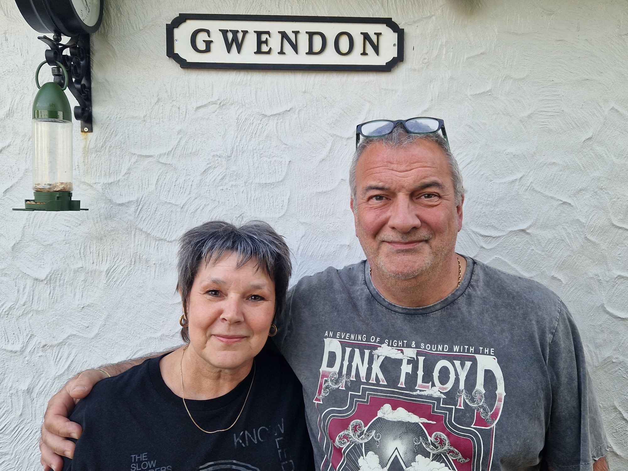 hosts stood outside gwendon sign