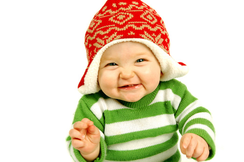 smiling baby with red hat